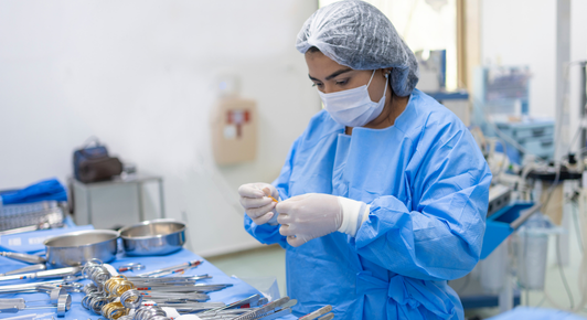 Patient wearing shoulder sling after arthroscopic shoulder surgery recovery
